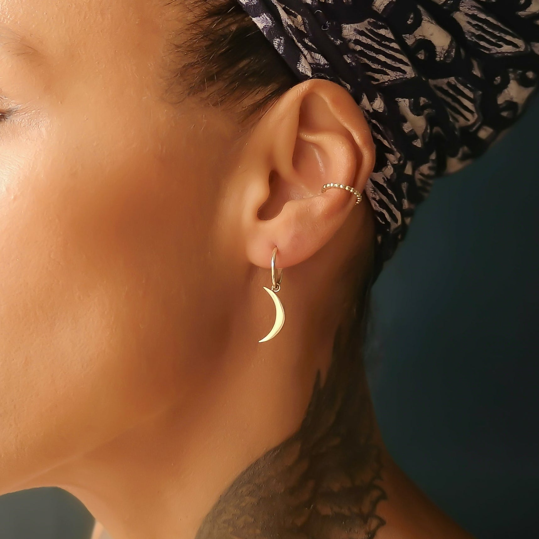 gold hoops with crescent moon charms
