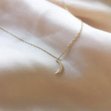 crescent mini moon necklace in solid gold close up by Louise Wade London